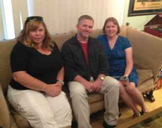 Caroline Rupprecht, Michael, and Rebecca Eash get acquainted while sitting on Valentino's sofa