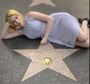 Amy reclines with Jack Pickford's star on Hollywood Boulevard